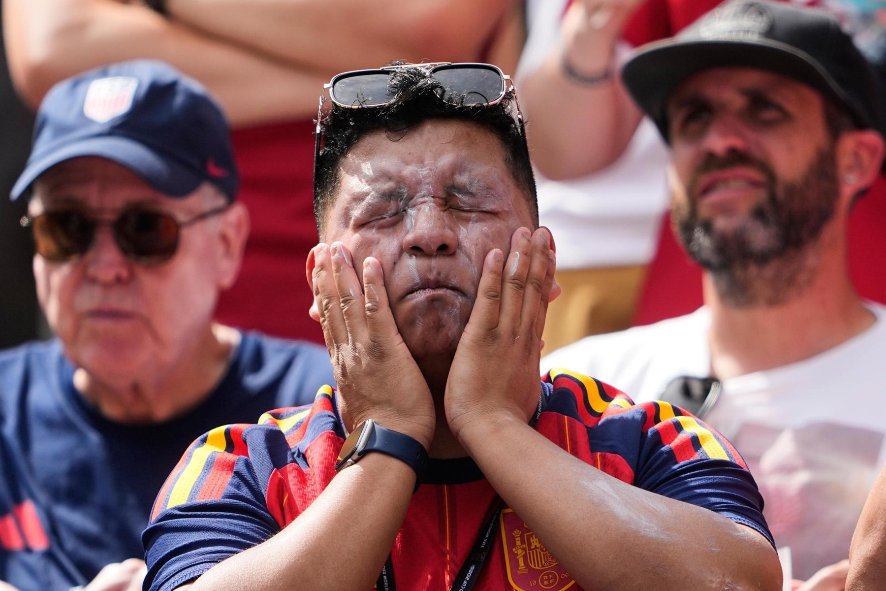 A spectator applies sunscreen before the Belgium–Egypt World Cup match in Seattle on June 15, 2026. Archival photograph; it does not identify the new formulation.