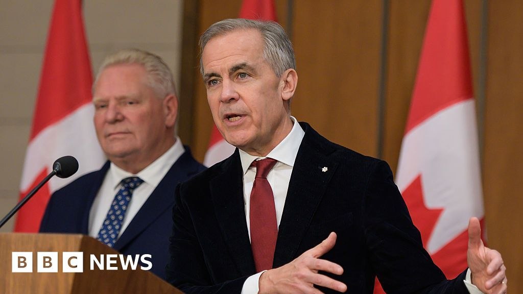 Mark Carney, right, and Doug Ford at a news conference in Ottawa, December 18, 2025. File photograph used by the source report.