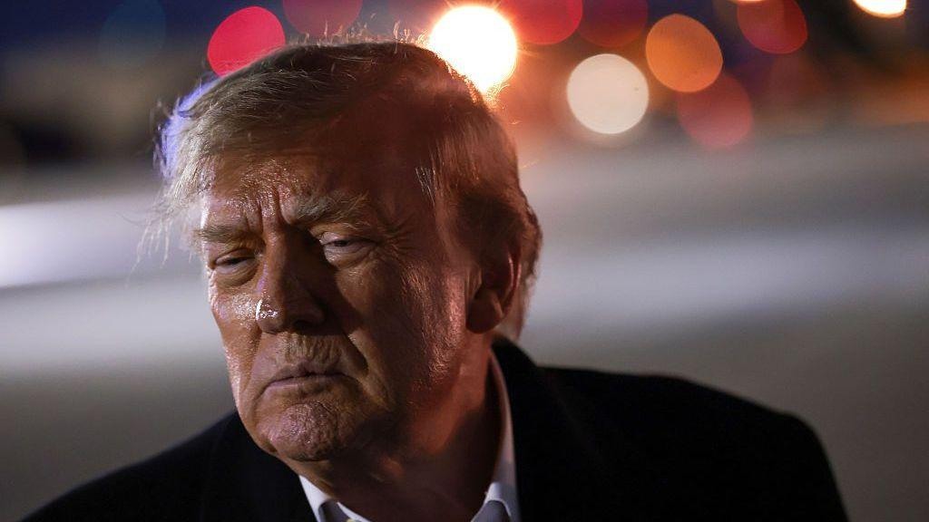 Donald Trump at Joint Base Andrews on October 21, 2026; not a photograph of the deposition hearing.