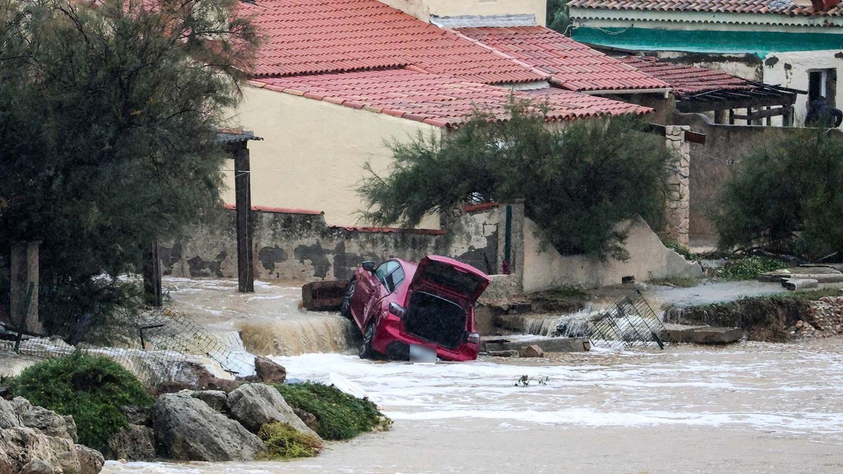 A car caught in floodwater in Saint-Mitre-les-Remparts, near Marseille.